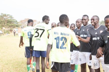 Umri Footbal Club players (left) participate in a pre-match handshake with their opponent, Griffins FC, during the just-concluded Salama Supercup tournament on December 31t, 2021, at the Bungoma Airstrip grounds. PHOTO/SEREMA PHOTOGRAPHY